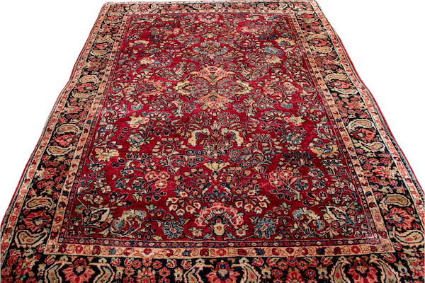 A brilliant red, blue and gold hand-knotted wool sarouk area rug